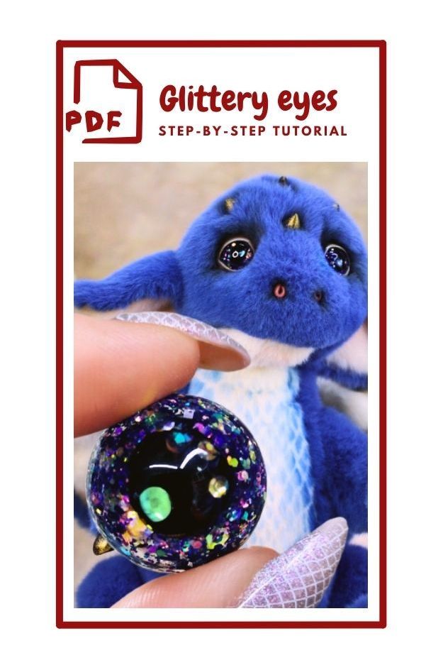 The image shows a cover for a PDF titled "Glittery eyes STEP-BY-STEP TUTORIAL." It features a close-up of a small, plush blue dragon with large, shiny